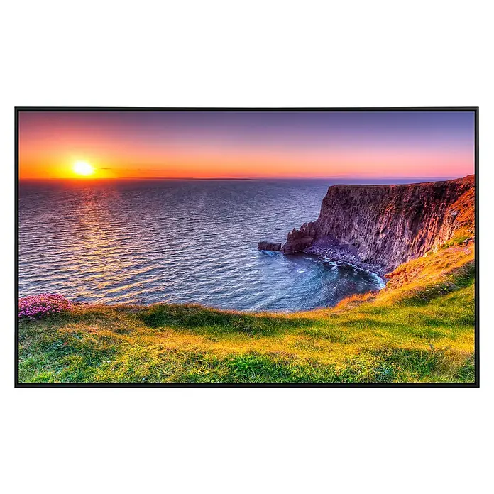 Papermoon Infrarot-Bildheizkörper Sonnenuntergang an den Moher Cliffs - 60 x 50 cm, 350 W - Großformatiger Bildschirm mit malerischer Sonnenuntergangsansicht über einer Küstenlandschaft mit Klippen und üppigem Grün im Vordergrund.