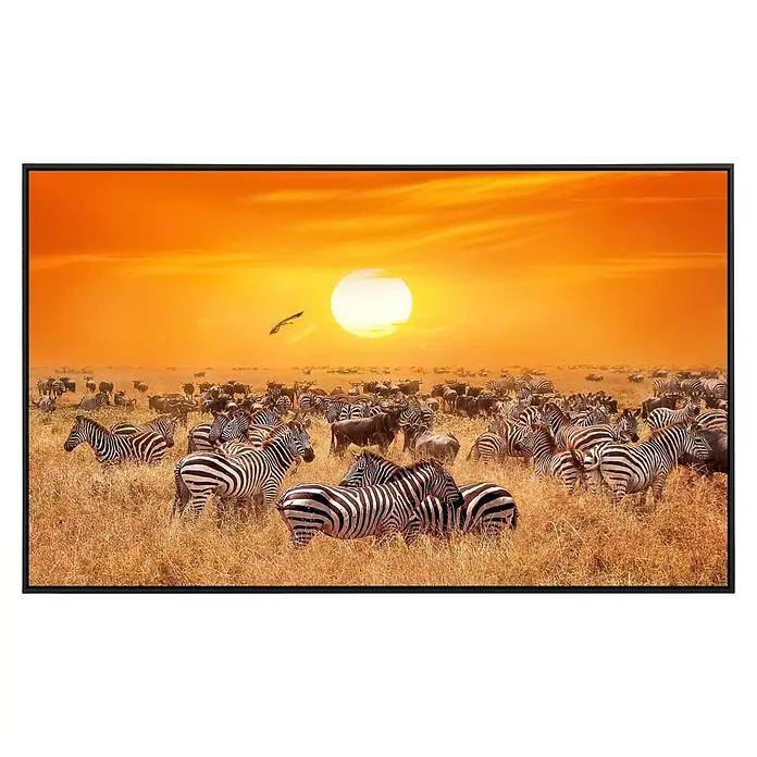 Papermoon Infrarot-Bildheizkörper Afrikanische Antilopen und Zebras - 90 x 50 cm, 450 W - Tierfotografie mit Zebras und Gnus in der afrikanischen Savanne bei Sonnenuntergang, gerahmt und fertig zum Aufhängen.