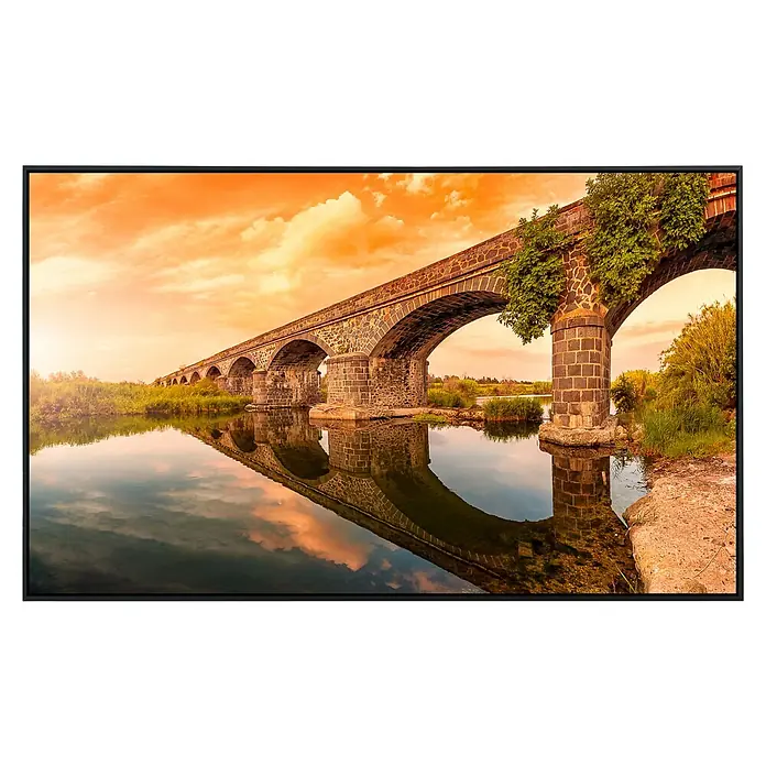 Papermoon Infrarot-Bildheizkörper Alte Flussbögen Cedrino - 60 x 50 cm, 350 W - Foto einer alten Steinbrücke mit gelbem Himmel und friedlichem Wasser, perfekt für eine ruhige Wanddekoration.