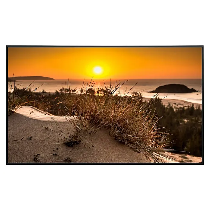 Papermoon Infrarot-Bildheizkörper Glühende Sonne Bush View - 100 x 60 cm, 800 W - Dünenlandschaft bei Sonnenuntergang: Das Bild zeigt einen malerischen Strand mit Dünengras im goldenen Abendlicht.