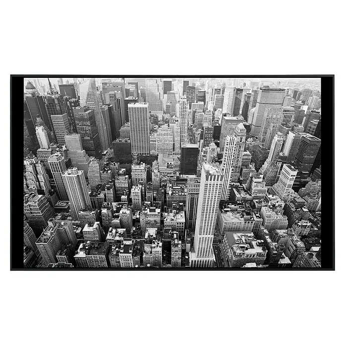 Papermoon Infrarot-Bildheizkörper Manhattan Stadtbild - 120 x 60 cm, 1.200 W - Schwarz-Weiß-Foto der Skyline von New York, das die architektonische Pracht und die dichte städtische Landschaft des Big Apple zeigt.