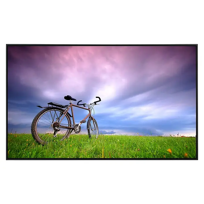 Papermoon Infrarot-Bildheizkörper Fahrrad in Grünland - 90 x 50 cm, 450 W - Ein Fahrrad steht auf einer grünen Wiese unter einem bewölkten Himmel. Es ist vor einem Bildschirm dargestellt.