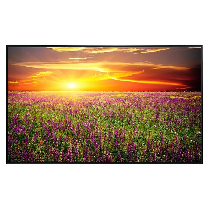 Papermoon Infrarot-Bildheizkörper Blumenwiese Sonnenuntergang - 90 x 50 cm, 450 W - Ein atemberaubender Sonnenuntergang über einem blühenden Blumenfeld, eingefangen in einem eleganten, modernen Rahmen. Die lebendigen Farben setzen Akzente.