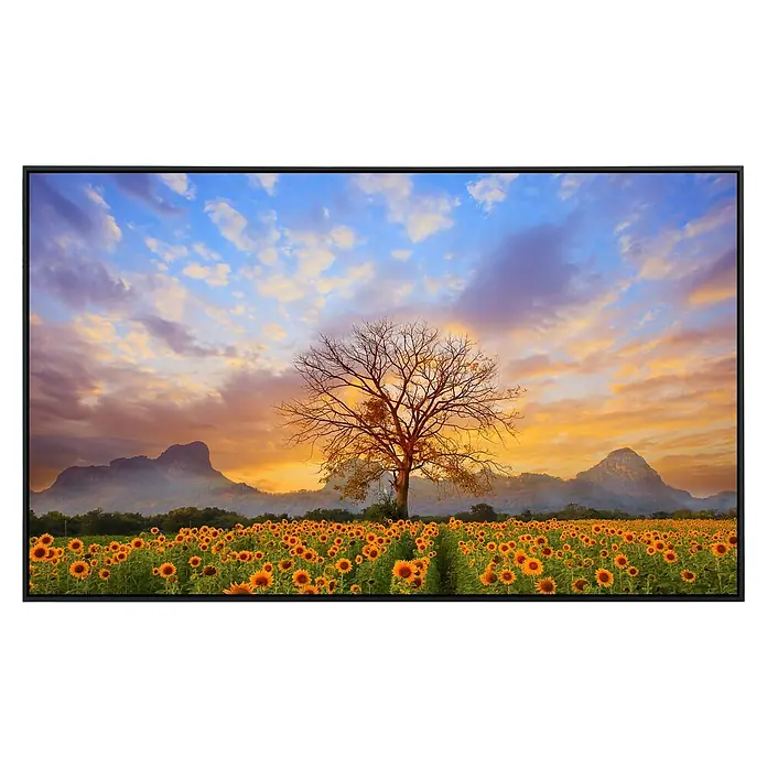 Papermoon Infrarot-Bildheizkörper Sonnenblumenlandschaft - 120 x 60 cm, 1.000 W - Das Produkt ist ein gerahmtes Kunstwerk mit einem lebendigen Sonnenblumenfeld, einem Baum und einer malerischen Hügellandschaft bei Sonnenuntergang.