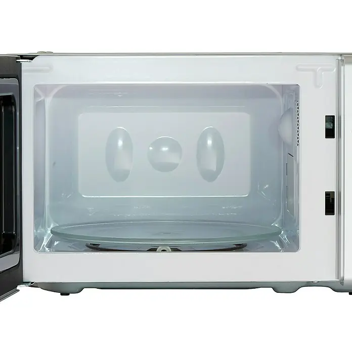 PKM Einbau-Mikrowelle MW700-20 UB2 - Max. Leistung: 700 W, 20 l, Silber - Aufnahme eines leeren Mikrowellenofens mit Drehteller, der die moderne Gerätekonstruktion und Funktionalität hervorhebt.