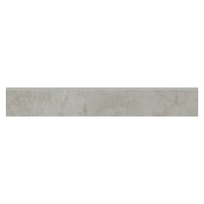 Zócalo cerámico Origine - 9 x 60 cm, Latte, Mate - Losa de piedra gris con una textura irregular y finas grietas, ideal para interiores y exteriores, ofreciendo una superficie natural y robusta.
