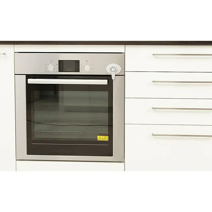 Dreambaby Backofentür-Verschluss - Weiß, Kleben - Einbauherd aus Edelstahl neben weißen Schubladen, ideal für moderne Küchen mit elegantem Design und praktischer Funktionalität.