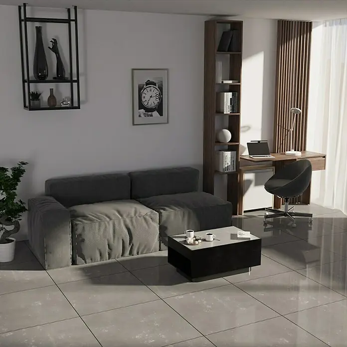 Feinsteinzeugfliese One - 74,5 x 74,5 cm, Grau, Schimmernd - Stilvolles Wohnzimmer mit grauem Sofa, Couchtisch und Bücherregal neben einem Schreibtisch mit Stuhl. Ein modernes und gemütliches Interieur.