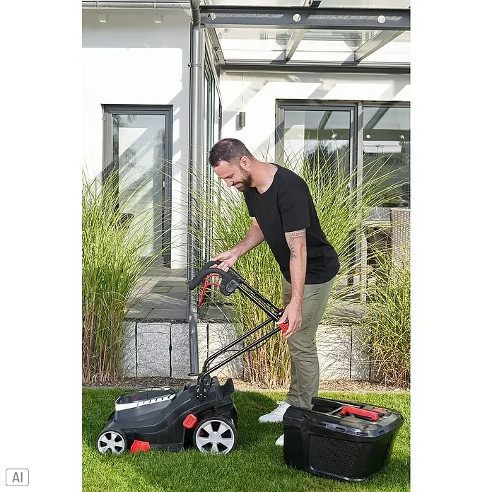 AL-KO Bosch Home & Garden Compatible Akku-Rasenmäher 3.82 Li Easy - 18 V, 2 Akkus, 4 Ah, Schnittbreite: 38 cm - Ein Mann montiert einen Rasenmäher im Garten. Der Rasenmäher ist schwarz und rot mit einem Fangkorb.