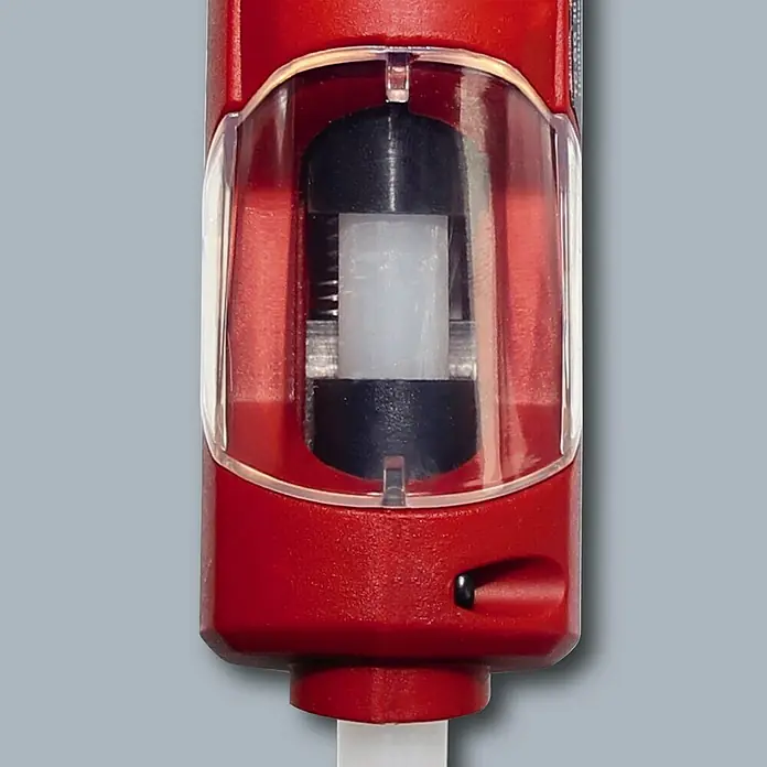 Einhell Classic Heißklebepistole TC-GG 30 - Durchmesser Klebepatrone: 11 mm - Nahaufnahme eines roten Einhell-Geräts mit transparentem Fenster, das eine schwarze Walze und eine weiße Säule zeigt.