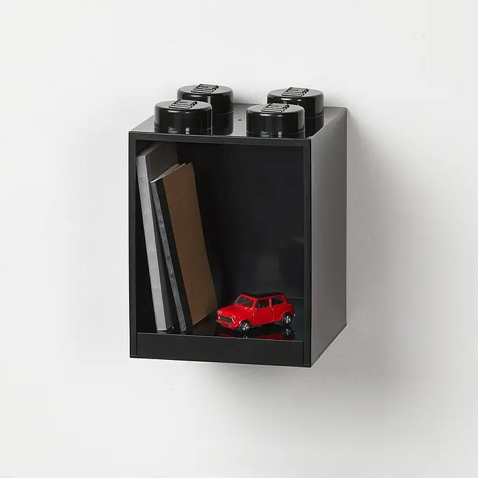 Lego Wandregal Brick - L x B x H: 15,9 x 16,1 x 21,2 cm, Kunststoff, Schwarz - Schwarzes LEGO-Regal mit Büchern und einem roten Spielzeugauto an einer weißen Wand, das eine spielerische Aufbewahrungslösung bietet.