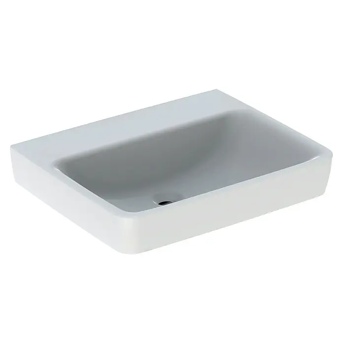 Geberit Renova Plan Waschtisch - 60 x 48 cm, Ohne Spezialglasur, Hahnloch: Ohne, Ohne Überlauf, Weiß - Nahaufnahme eines modernen, rechteckigen Waschbeckens aus weißer Keramik mit sanft abgerundeten Kanten und einem mittigen Abflussloch.