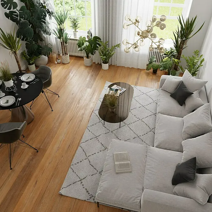 Parkett - Eiche Romeo, Landhausdiele, 2.200 x 260 x 15 mm - Eine stilvolle Wohnzimmeransicht mit einem bequemen Sofa und einem eleganten Couchtisch auf einem gemusterten Teppich.