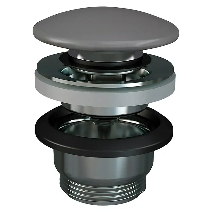 RAK Ceramics Feeling Ablaufventil - 1 ¼″, Grau, Mit Druckknopf - Nahaufnahme eines Waschbeckenstöpsels mit verschiedenen Materialien und Oberflächen.