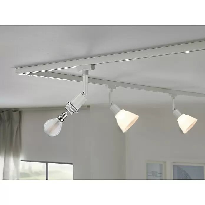 Paulmann URail LED-Spot DecoSystems - Lampenfassung: E14, Farbe: Weiß - Weißes Schienensystem an der Decke mit einer klaren Glühbirne, die eingeschraubt wird. Zwei weitere weiße Strahler leuchten.