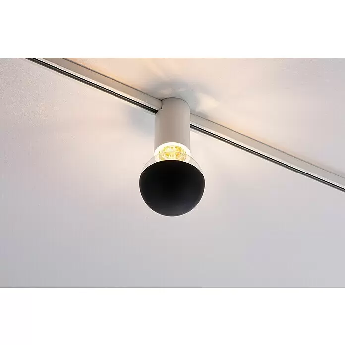 Paulmann URail Deckenleuchte Ceiling Socket - 20 W, Lampenfassung: E27, Weiß - Schwarze und klare Stromschienenleuchte leuchtend, an einem Deckenstromschienensystem befestigt.