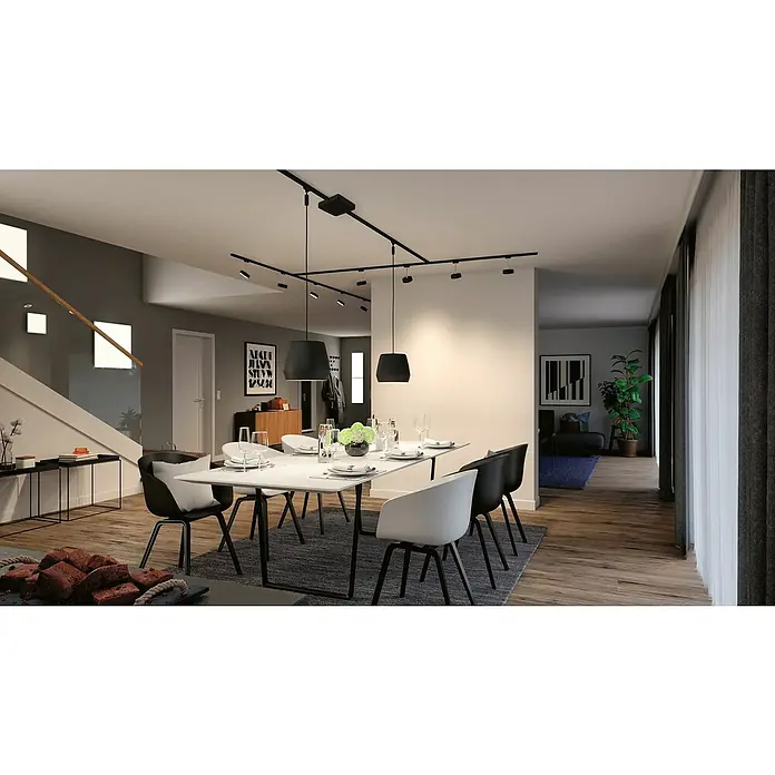 Paulmann URail Mittel-Einspeisung Zigbee - 300 W, Schwarz - Ein moderner Essbereich mit einem weißen Esstisch, schwarzen und weißen Stühlen und einer auffälligen schwarzen Schienenbeleuchtung.