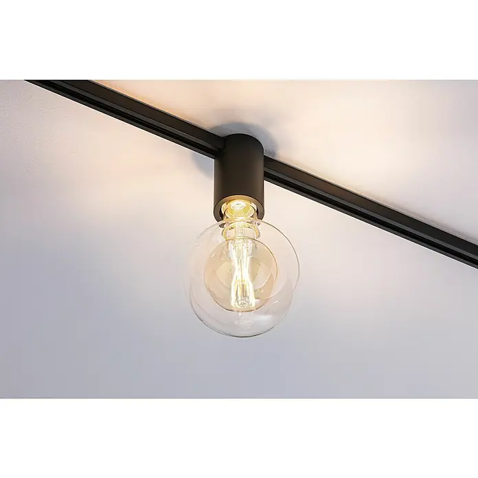 Paulmann URail Deckenleuchte Ceiling Socket - 20 W, Lampenfassung: E27, Schwarz matt - Nahaufnahme einer modernen, schwarzen Schienenleuchte mit einer klaren Glühbirne, die warmes Licht in einem zeitgenössischen Design ausstrahlt.