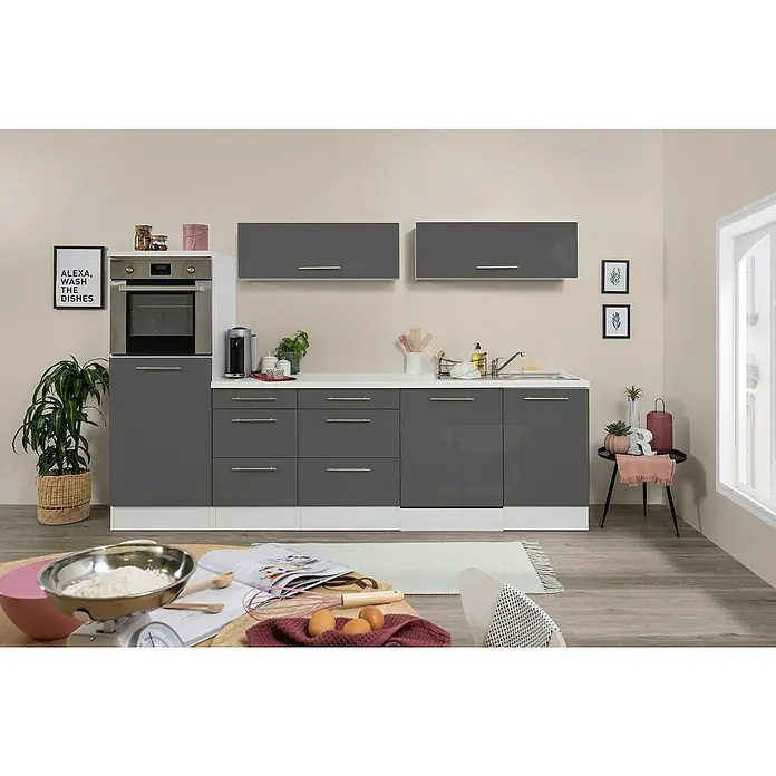 Respekta Premium Inselküche RP280IWGCBO - Breite: 280 cm, Grau, Mit Elektrogeräten - Ein modernes Kücheninterieur mit grauen Schränken, einer Arbeitsplatte in Weiß und einem Ofen. Dekorative Elemente und Küchenutensilien sind vorhanden.