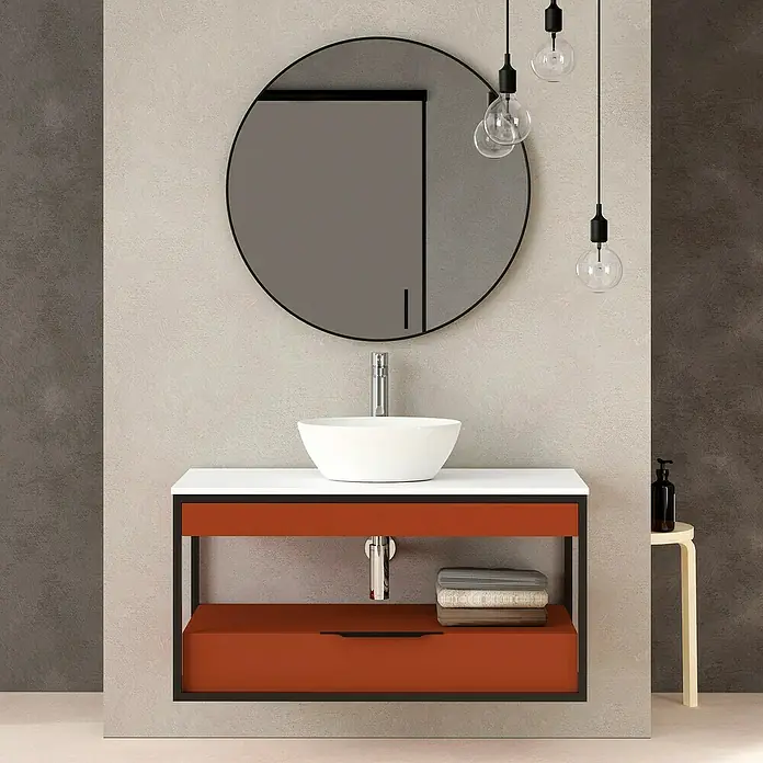 Artysan Conjunto de mueble de baño Izaro - Ancho: 100 cm, 3 pzs., Teja/Blanco, Mate - Mueble de baño con espejo redondo, tres bombillas colgantes y lavabo blanco. El mueble es naranja con marco negro.
