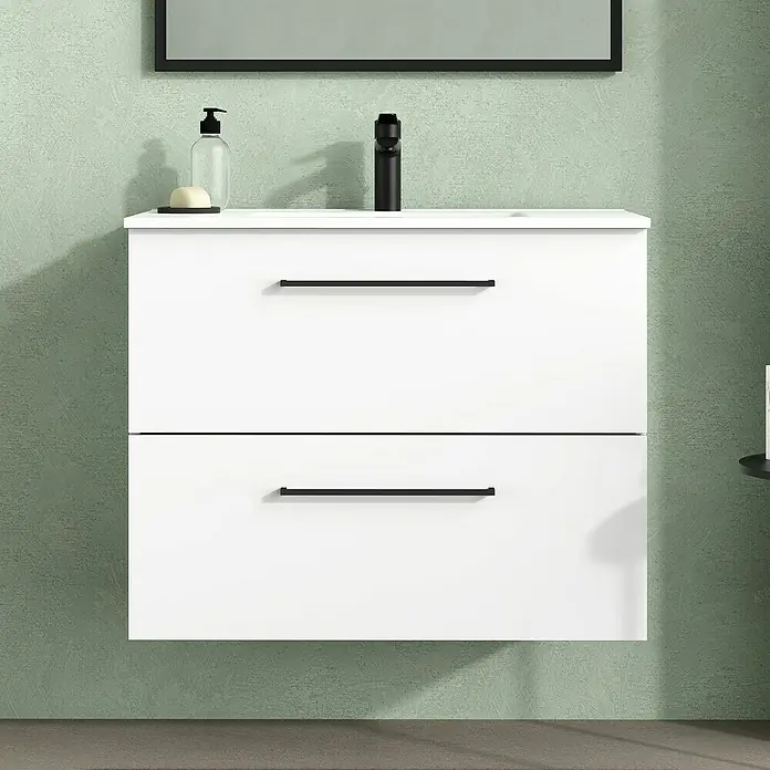 Artysan Mueble bajo de lavabo Arosa - L x An x Al: 44,6 x 80 x 64 cm, Blanco - Primer plano de un mueble de baño blanco con dos cajones y tiradores negros sobre una pared texturizada.