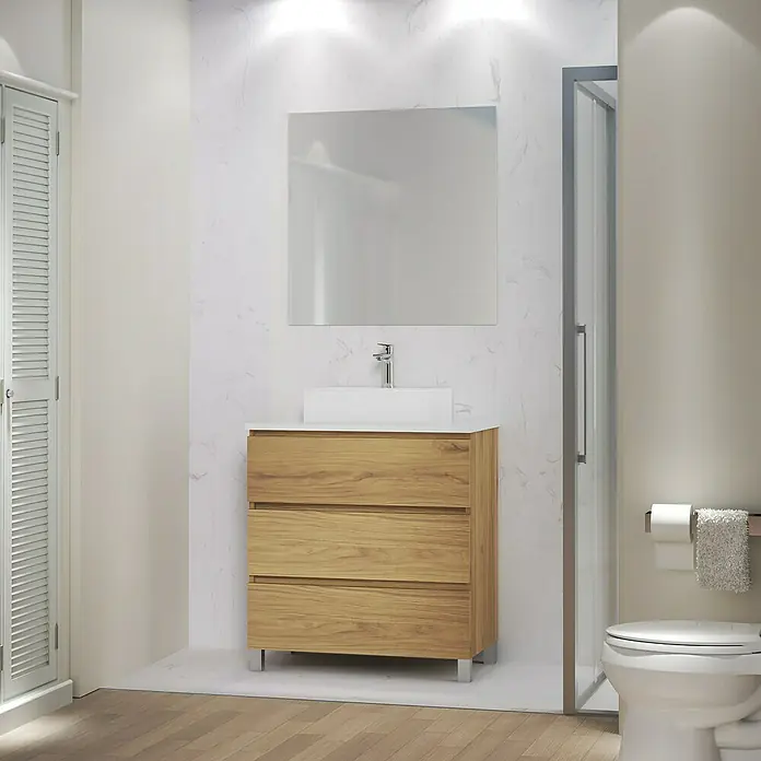 Artysan Mueble bajo de lavabo Colours - L x An x Al: 44,6 x 80 x 83,3 cm, Roble Guadarrama - Interior de baño con un moderno tocador de madera con cajones y un lavabo sobre encimera blanco, colocado bajo un espejo cuadrado.