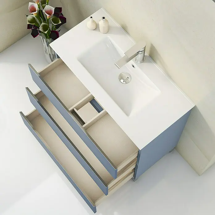 Artysan Mueble bajo de lavabo Ons - L x An x Al: 38,6 x 60 x 83,3 cm, Azul - La imagen muestra un tocador de baño moderno con cajones abiertos. Los colores son brillantes y acogedores.