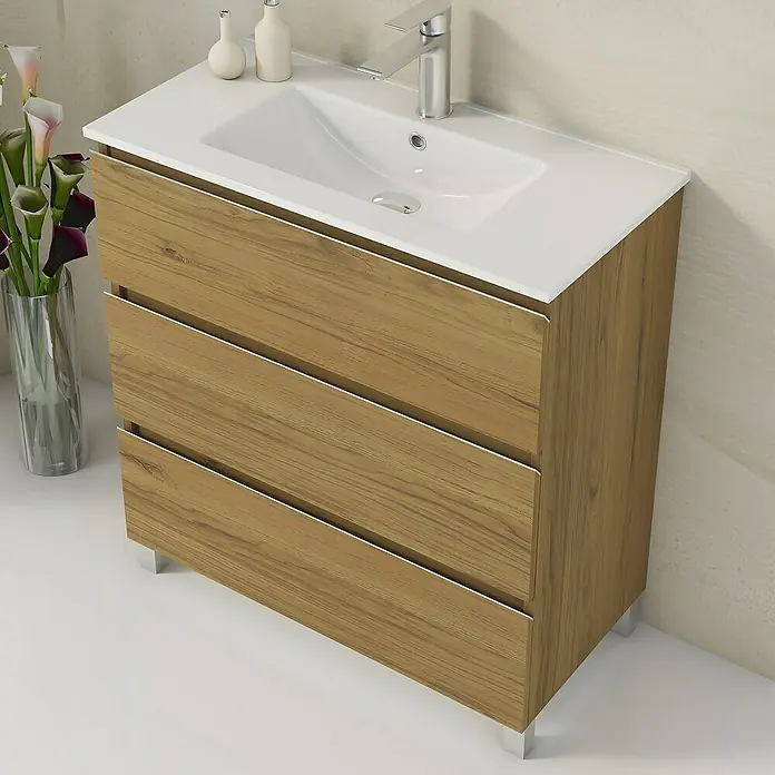 Artysan Mueble bajo de lavabo Ons - L x An x Al: 38,6 x 80 x 83,3 cm, Roble Guadarrama - Un mueble de lavabo con tres cajones con aspecto de madera y un lavabo blanco. Mueble de baño práctico.