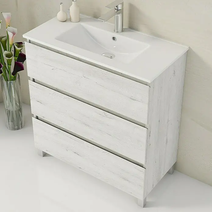 Artysan Mueble bajo de lavabo Ons - L x An x Al: 38,6 x 80 x 83,3 cm, Silver - Un mueble de baño con tres cajones y un grifo moderno. La superficie es blanca con una textura de vetas de madera.