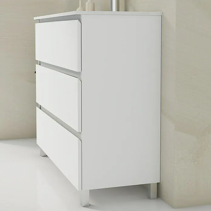 Artysan Mueble bajo de lavabo Ons - L x An x Al: 38,6 x 100 x 83,3 cm, Blanco - Esta imagen presenta una moderna cómoda blanca con tres cajones y patas plateadas, mostrando un mueble sencillo y elegante.