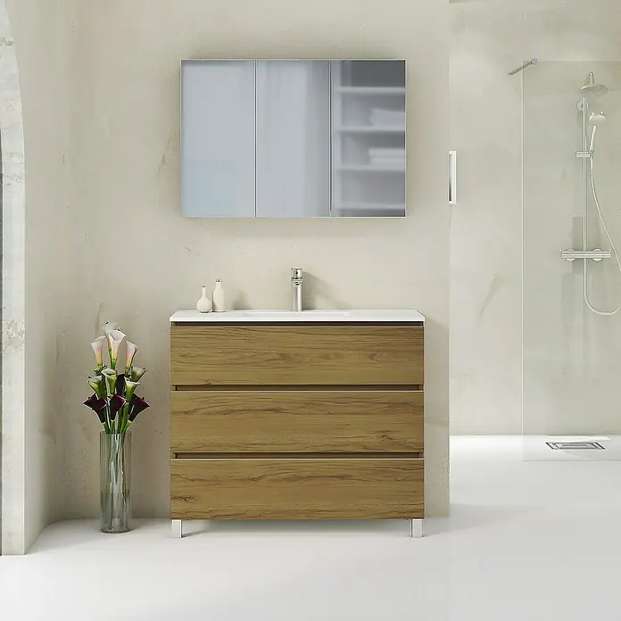 Artysan Mueble bajo de lavabo Ons - L x An x Al: 38,6 x 100 x 83,3 cm, Roble Guadarrama - Un lavabo moderno de baño con textura de madera y tres cajones bajo un armario con espejo.