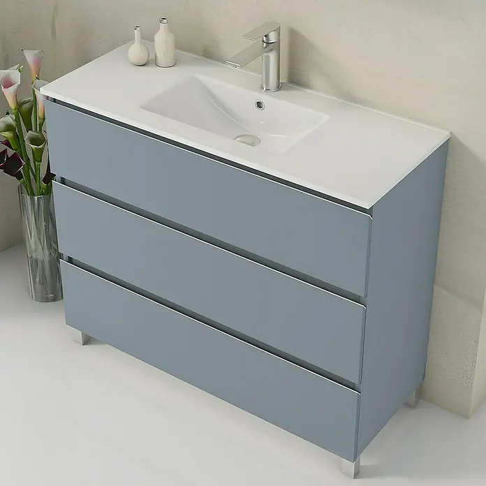 Artysan Mueble bajo de lavabo Ons - L x An x Al: 38,6 x 100 x 83,3 cm, Azul - Un moderno mueble de baño gris con tres cajones, encimera blanca y lavabo integrado.