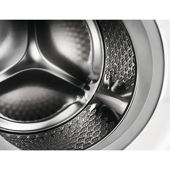 AEG Lavadora EN7F4722AN - L x An x Al: 55,3 x 59,6 x 81,9 cm, 7 kg, Potencia máx.: 2.200 W - Primer plano del tambor de una lavadora que muestra un diseño de acero inoxidable y un patrón de orificios único para un lavado suave.