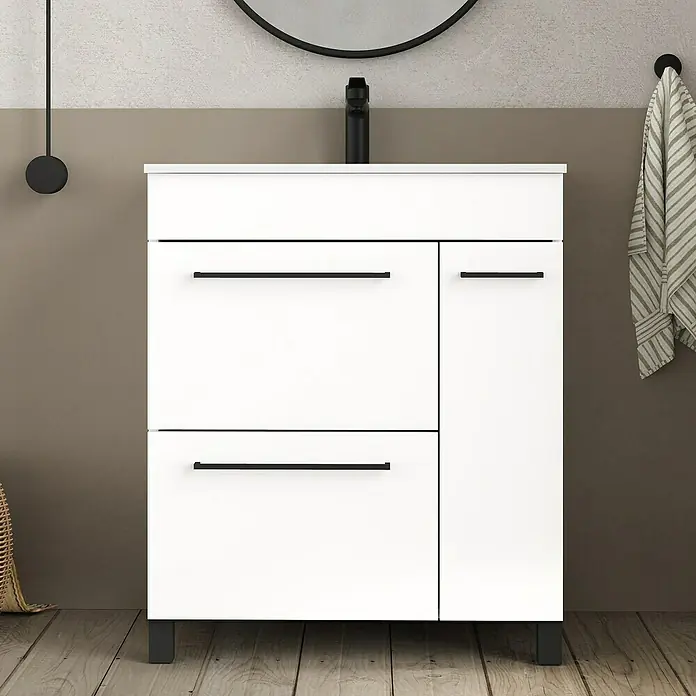 Artysan Mueble bajo de lavabo Tabarca - L x An x Al: 44,6 x 70 x 83,3 cm, Blanco - Un tocador blanco moderno con tiradores y patas negros frente a una pared de dos tonos.