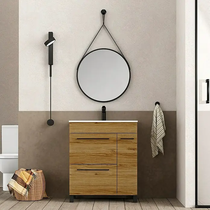 Artysan Mueble bajo de lavabo Tabarca - L x An x Al: 44,6 x 80 x 83,3 cm, Roble Guadarrama - Elegante mueble de baño con textura de madera, complementado con un espejo redondo y una lámpara moderna.