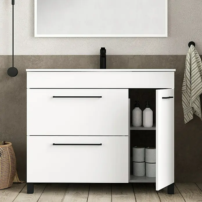 Artysan Mueble bajo de lavabo Tabarca - L x An x Al: 44,6 x 100 x 83,3 cm, Blanco - Un primer plano de un mueble de baño con cajones y una puerta abierta que muestra papel higiénico y dispensadores de jabón en el interior.