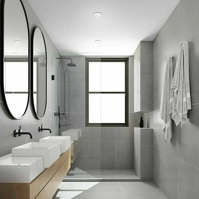 Briloner Foco empotrable Plat - 3 W, Ø x Al: 7,5 cm x 3,5 mm, Blanco, Blanco cálido - Baño luminoso con doble lavabo, espejos ovalados y azulejos grises, ofreciendo una estética moderna y minimalista.