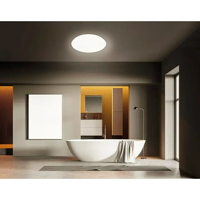 Briloner Plafón LED redondo Stelo - Ø x Al: 28 x 9,5 cm, Blanco estrellado, Color de luz: Blanco neutro - Lámpara de techo redonda en un baño moderno con bañera y diseño minimalista, creando un ambiente luminoso y acogedor.