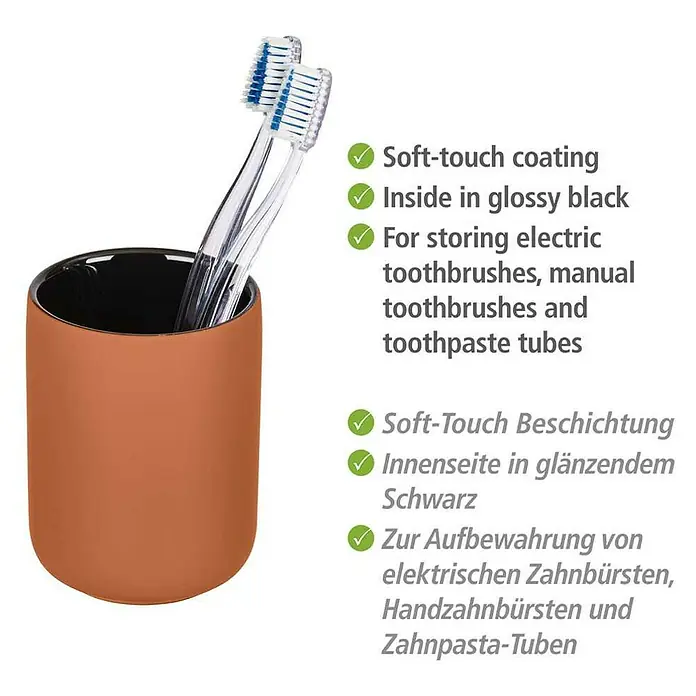 Wenko Zahnputzbecher Avellino - Keramik, Terracotta - Bild einer orangefarbenen Zahnbürstenhalterung mit dem Hinweis auf die Soft-Touch-Beschichtung und den glänzend schwarzen Innenraum.