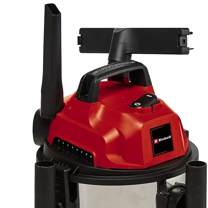 Einhell Elektro-Nass- & Trockensauger - 1.250 W, Behältervolumen: 20 l - Rot-schwarze Nass-Trocken-Sauger-Motoreinheit mit Griff, Schalter und angesetzten Fugen- und Bürstendüsen.