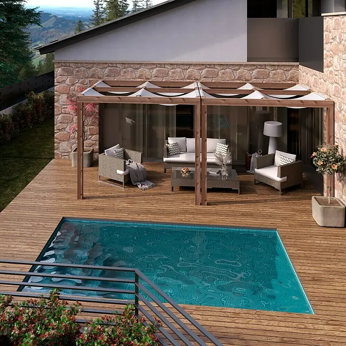 Pérgola adosada Cubik - L x An: 300 x 300 cm - Imagen de una pérgola con techo de tela, creando una zona de estar sombreada junto a una piscina, ideal para relajarse al aire libre.