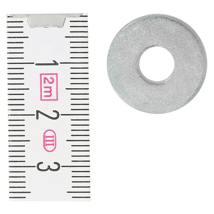 Profi Depot Karosseriescheibe VZ - Innendurchmesser: 6,4 mm, Außendurchmesser: 20 mm, 100 Stk., Verzinkt - Nahaufnahme einer Unterlegscheibe neben einem Zollstock zur Messung. Die helle Unterlegscheibe liegt direkt neben dem Lineal.