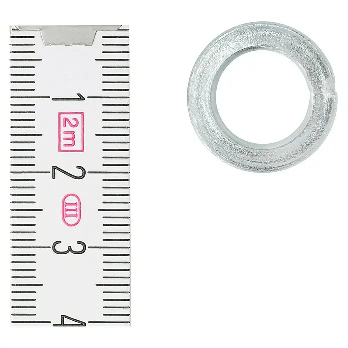Profi Depot Federring - 12,2 mm, 100 Stk., DIN 127, Verzinkt - Nahaufnahme einer Unterlegscheibe mit Messband. Das Bild zeigt Details des Produkts und seine relative Größe.