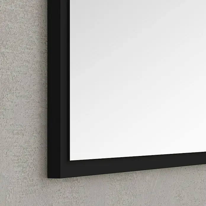 Artysan Espejo Arosa - 70 x 80 cm, Negro - Primer plano de un espejo moderno con un elegante marco negro montado en una pared texturizada.