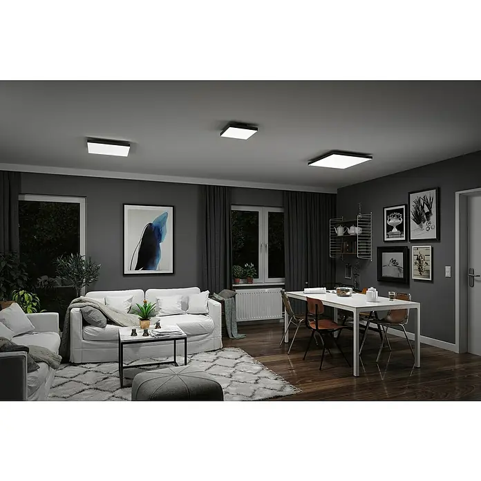 Paulmann LED-Panel Velora Rainbow - 16 W, L x B x H: 29,5 x 29,5 x 6,4 cm, Schwarz, RGBW - Eine moderne Wohnzimmeransicht mit stilvollen quadratischen LED-Deckenleuchten, die eine helle und einladende Atmosphäre schaffen.