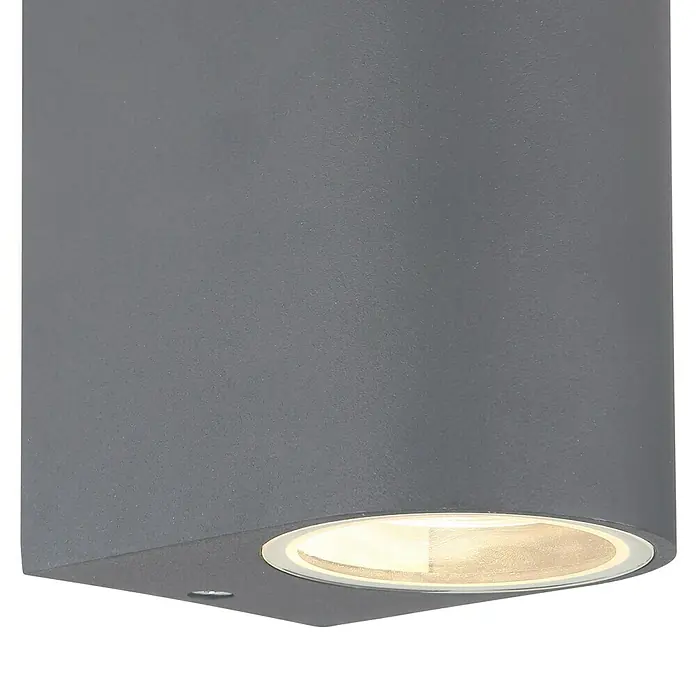 Globo Aplique exterior Veronika - 35 W, L x An x Al: 9,2 x 6,8 x 15 cm, Antracita, GU10, Redondeada - Primer plano de una moderna lámpara de pared gris con iluminación cálida, ideal para espacios exteriores elegantes.