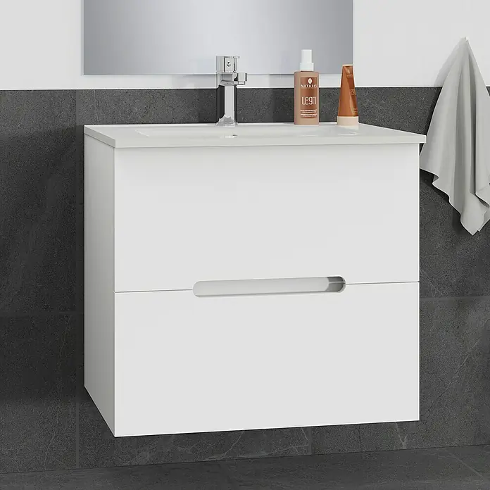 Artysan Mueble bajo de lavabo India Slim - L x An x Al: 39 x 60 x 54,5 cm, Blanco - Mueble de baño blanco con lavabo, grifo y artículos de higiene personal contra una pared gris. Un mueble elegante para baños modernos.