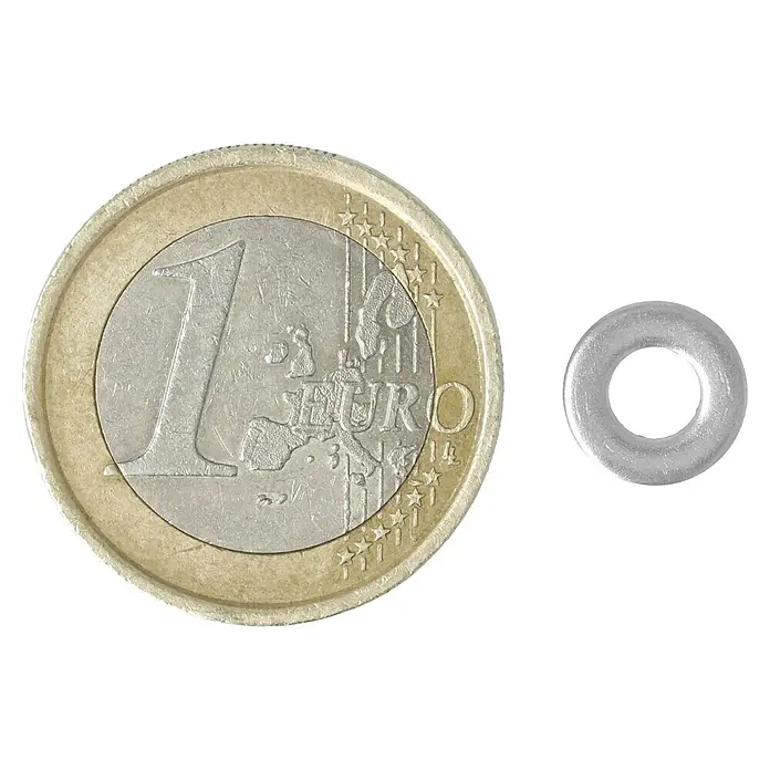 Profi Depot Unterlegscheibe A2 - Außendurchmesser: 9 mm, 100 Stk., Edelstahl - Ein Euro-Münze liegt neben einer Unterlegscheibe. Die Unterlegscheibe ist silberfarben und klein.