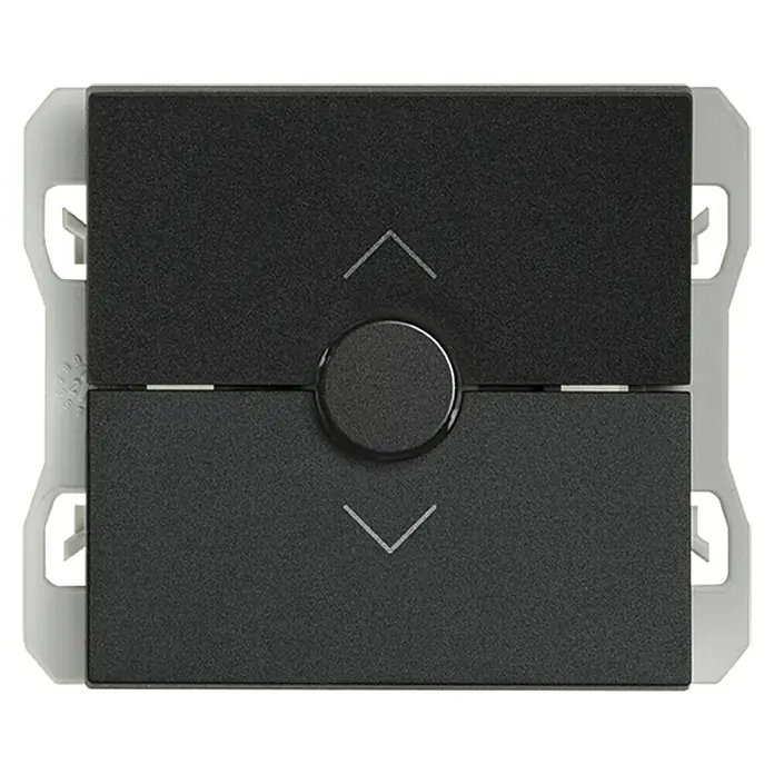 Simon 270 Interruptores para persianas - Negro, Mate, Montaje en superficie - Imagen de un interruptor de persiana negro y gris. El dispositivo tiene botones de subir y bajar y un mando giratorio central.