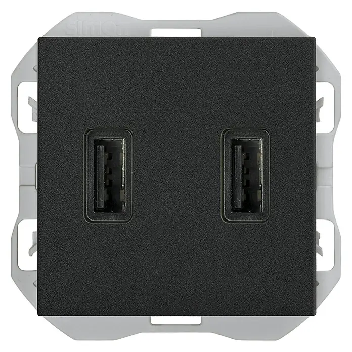 Simon 270 Toma USB - Negro, x 2, Plástico, Colocar - Primer plano de un enchufe de pared USB doble negro de Simon, ideal para cargar dispositivos sin adaptadores. Diseño elegante apto para interiores modernos.